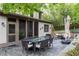 Rear exterior featuring an outdoor dining set and a cozy seating area with a fire pit at 138 Garland Ave, Decatur, GA 30030
