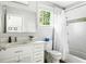 Bright bathroom featuring white cabinets, subway tile, and modern fixtures at 138 Garland Ave, Decatur, GA 30030