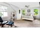 Bright bedroom with a ceiling fan, plush carpet, and a neutral color palette at 138 Garland Ave, Decatur, GA 30030