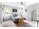 Bright bedroom with plush carpet, a ceiling fan, and natural light from the surrounding windows at 138 Garland Ave, Decatur, GA 30030