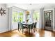 Dining area with windows, hardwood floors, and a modern light fixture at 138 Garland Ave, Decatur, GA 30030