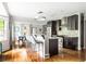 Open kitchen with dark wood cabinets, stainless steel appliances, and a breakfast bar at 138 Garland Ave, Decatur, GA 30030