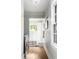 Laundry room with stainless steel washer and dryer, white cabinets, and natural light from the window at 138 Garland Ave, Decatur, GA 30030