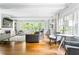 Bright and open living room with hardwood floors, a fireplace, and large windows at 138 Garland Ave, Decatur, GA 30030