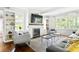 Cozy living room with fireplace, built-in shelves, and a plush rug on hardwood floors at 138 Garland Ave, Decatur, GA 30030