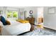 Bright main bedroom with hardwood floors, large windows and view into ensuite bathroom and closet at 138 Garland Ave, Decatur, GA 30030