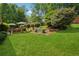 Picturesque backyard with deck and lush lawn space for entertaining and recreation at 1932 Brenda Dr, Austell, GA 30168
