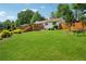 Expansive backyard with lush green grass and a welcoming deck, perfect for outdoor entertaining and relaxation at 1932 Brenda Dr, Austell, GA 30168