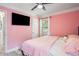 Bright bedroom featuring a television, one window, and hardwood floors at 1932 Brenda Dr, Austell, GA 30168