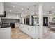 Open kitchen design with white cabinets, granite countertops, and stainless steel appliances at 1932 Brenda Dr, Austell, GA 30168
