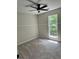 Cozy bedroom with plush carpet, ample natural light, and soothing neutral paint at 2711 Teal Landing Dr, Morrow, GA 30260