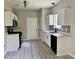Updated kitchen featuring white cabinets, stainless steel appliances, and modern finishes at 2711 Teal Landing Dr, Morrow, GA 30260