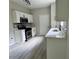Well-lit kitchen featuring a double sink, stainless appliances, and modern countertops at 2711 Teal Landing Dr, Morrow, GA 30260