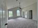 Spacious primary bedroom with neutral carpet, vaulted ceilings, and ensuite bathroom access at 2711 Teal Landing Dr, Morrow, GA 30260