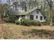 Traditional home exterior with mature trees offering shade and privacy at 650 Sage St, Temple, GA 30179