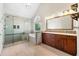 Bright bathroom showcasing a glass shower, soaking tub, and double sink vanity with granite countertops at 5652 Harbormist Dr, Powder Springs, GA 30127