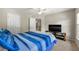 Bedroom with a modern bed set, TV, and natural light at 5652 Harbormist Dr, Powder Springs, GA 30127