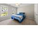 Bedroom with multiple windows and a cozy bed at 5652 Harbormist Dr, Powder Springs, GA 30127