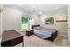 This bedroom has a window with natural light, carpeted floors, and neutral walls at 5652 Harbormist Dr, Powder Springs, GA 30127