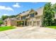 A spacious house features a driveway, multiple car garage, and lush green surroundings at 5652 Harbormist Dr, Powder Springs, GA 30127