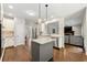 Modern kitchen with stainless steel appliances, granite countertops, and an island at 5652 Harbormist Dr, Powder Springs, GA 30127