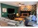 Cozy living room featuring a fireplace, stylish furniture, and a modern entertainment setup at 5652 Harbormist Dr, Powder Springs, GA 30127