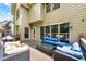 This covered outdoor patio has furniture and view of the yard at 5652 Harbormist Dr, Powder Springs, GA 30127