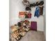 Walk-in closet featuring multiple shelves, a variety of shoes and luggage at 5652 Harbormist Dr, Powder Springs, GA 30127