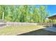 Spacious backyard featuring a large, well-maintained lawn and a wood fence for privacy and security at 1835 Wellston Dr, Lawrenceville, GA 30043