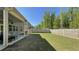 Large backyard offers privacy, a well-kept lawn, and a covered patio for outdoor enjoyment at 1835 Wellston Dr, Lawrenceville, GA 30043