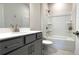 Bathroom with a shower and tub, light gray vanity with chrome finishes and fixtures at 1835 Wellston Dr, Lawrenceville, GA 30043