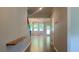 Bright entryway featuring hardwood floors and an open floor plan with views into the living room at 1835 Wellston Dr, Lawrenceville, GA 30043