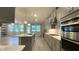 Modern kitchen with a large island, stainless steel appliances, and hardwood flooring at 1835 Wellston Dr, Lawrenceville, GA 30043