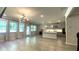 Light-filled living space seamlessly connects to the kitchen, boasting contemporary finishes and ample windows at 1835 Wellston Dr, Lawrenceville, GA 30043