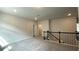 Carpeted loft featuring recessed lighting, view of staircase, and multiple doorways at 1835 Wellston Dr, Lawrenceville, GA 30043