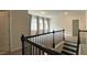Loft space showcasing stairs, windows with curtains, and connecting doorways at 1835 Wellston Dr, Lawrenceville, GA 30043