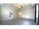 Spacious primary bedroom with neutral paint, tray ceilings, and an ensuite bathroom at 1835 Wellston Dr, Lawrenceville, GA 30043