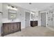 Dual vanity bathroom with modern mirrors, dark vanities, and a glass shower at 2506 Octavia Ln, Marietta, GA 30062