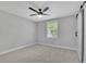 Bright bedroom with a modern ceiling fan, light grey walls, and a door to a closet at 2506 Octavia Ln, Marietta, GA 30062