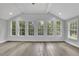 Bedroom with vaulted ceilings, shiplap walls, and large windows overlooking greenery at 2506 Octavia Ln, Marietta, GA 30062