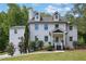Charming two-story home with a painted white brick facade and a well-maintained lawn at 2506 Octavia Ln, Marietta, GA 30062