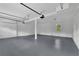Large garage featuring a gray floor, gray walls, storage, bright lights and a window at 2506 Octavia Ln, Marietta, GA 30062