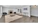 Bright living room featuring a stone fireplace, dark wood floors, and neutral color palette at 2506 Octavia Ln, Marietta, GA 30062