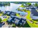 A captivating aerial view showcasing waterfront townhomes with private boat docks and lush green surroundings at 325 Berry Ct, Villa Rica, GA 30180