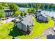 An aerial view of condos with grass lawns leading up to the water at 325 Berry Ct, Villa Rica, GA 30180