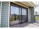Balcony door with sliding glass, a screen, and black railing at 325 Berry Ct, Villa Rica, GA 30180