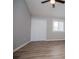Spacious bedroom with a ceiling fan, large closet, and window at 325 Berry Ct, Villa Rica, GA 30180