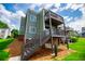 Multi-level condo building featuring two-story balconies and stairs at 325 Berry Ct, Villa Rica, GA 30180