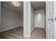 Inviting foyer with modern wood flooring, fresh paint, and attractive front door at 325 Berry Ct, Villa Rica, GA 30180