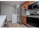 This kitchen features stainless steel appliances, including a refrigerator and a modern oven at 325 Berry Ct, Villa Rica, GA 30180